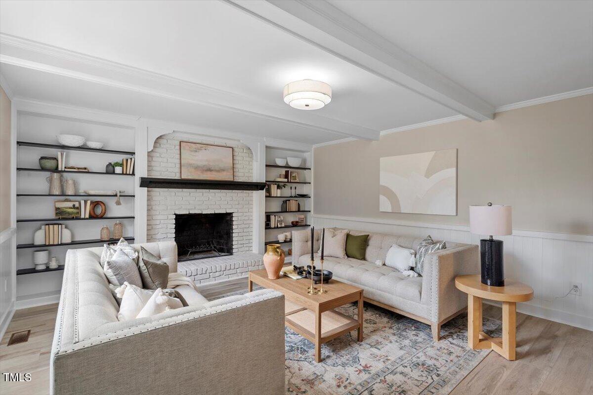 7300 Grist Mill Road Raleigh, NC 27615 - Photo 14 of 41 a living room with furniture and a fireplace