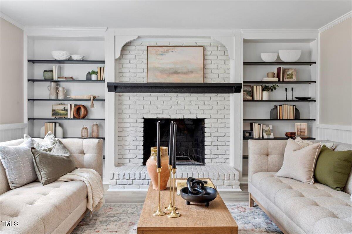 7300 Grist Mill Road Raleigh, NC 27615 - Photo 15 of 41 a living room with furniture and a fireplace