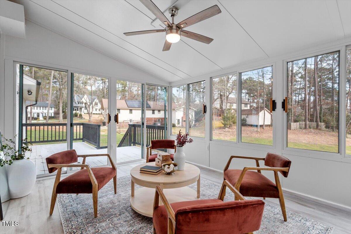 7300 Grist Mill Road Raleigh, NC 27615 - Photo 17 of 41 a living room with furniture and a floor to ceiling window