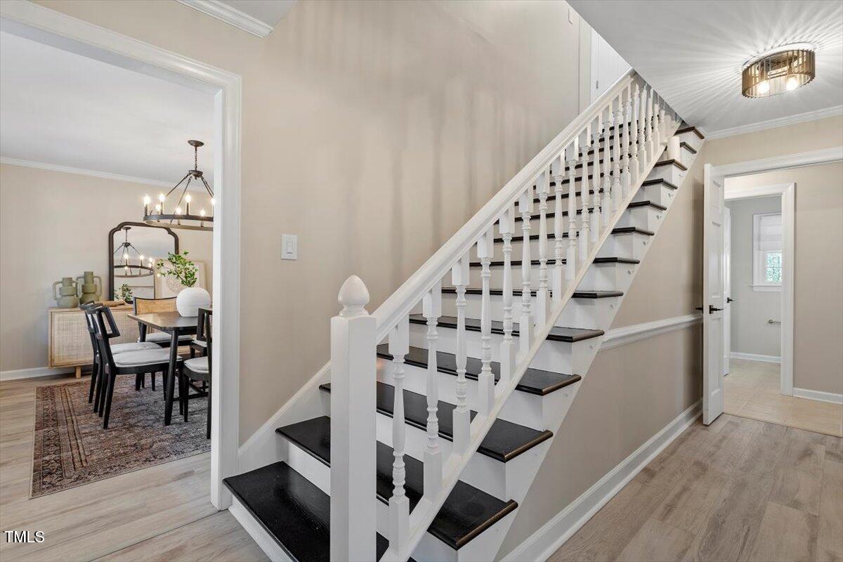 7300 Grist Mill Road Raleigh, NC 27615 - Photo 18 of 41 a view of entryway and hall with wooden floor
