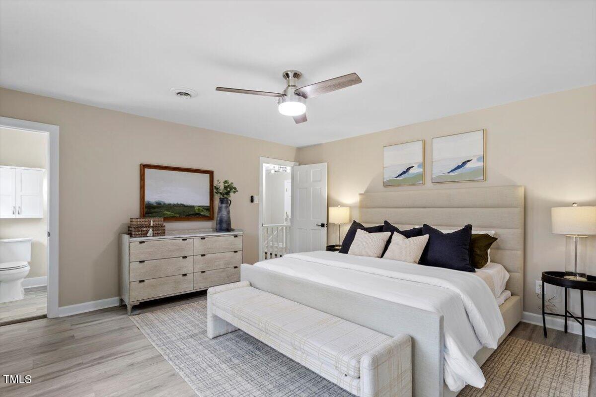 7300 Grist Mill Road Raleigh, NC 27615 - Photo 19 of 41 a bedroom with a bed and furniture