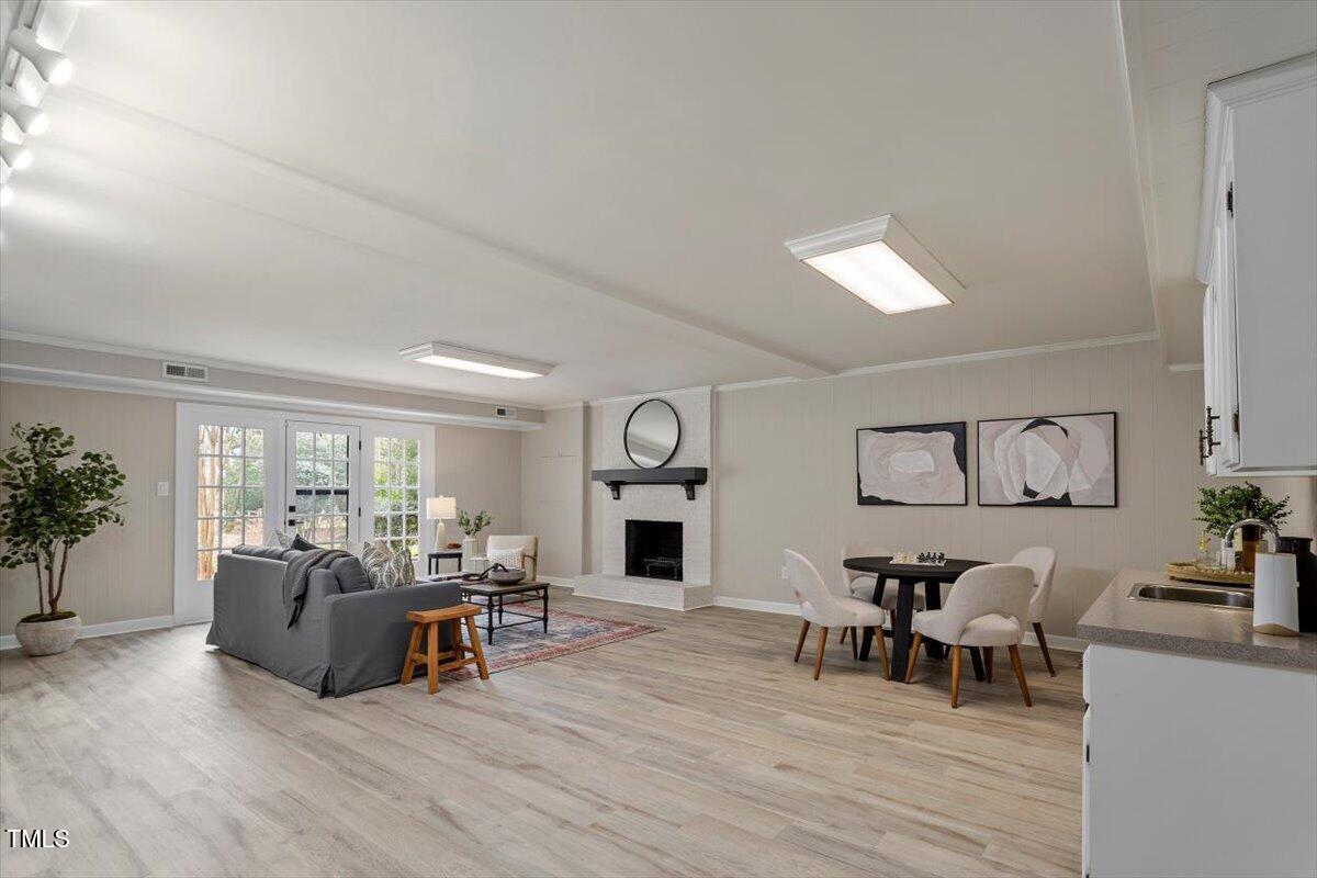 7300 Grist Mill Road Raleigh, NC 27615 - Photo 26 of 41 a living room with furniture and a fireplace