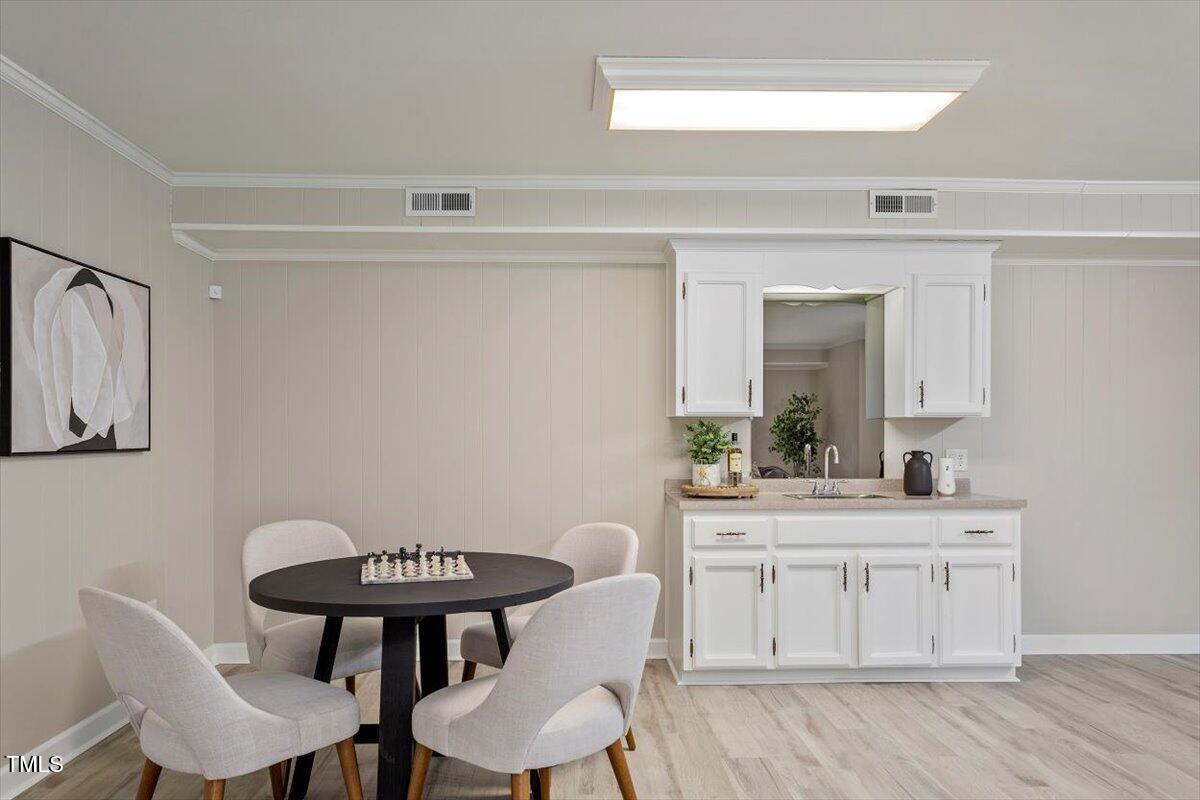 7300 Grist Mill Road Raleigh, NC 27615 - Photo 30 of 41 a view of a dining room with furniture and wooden floor