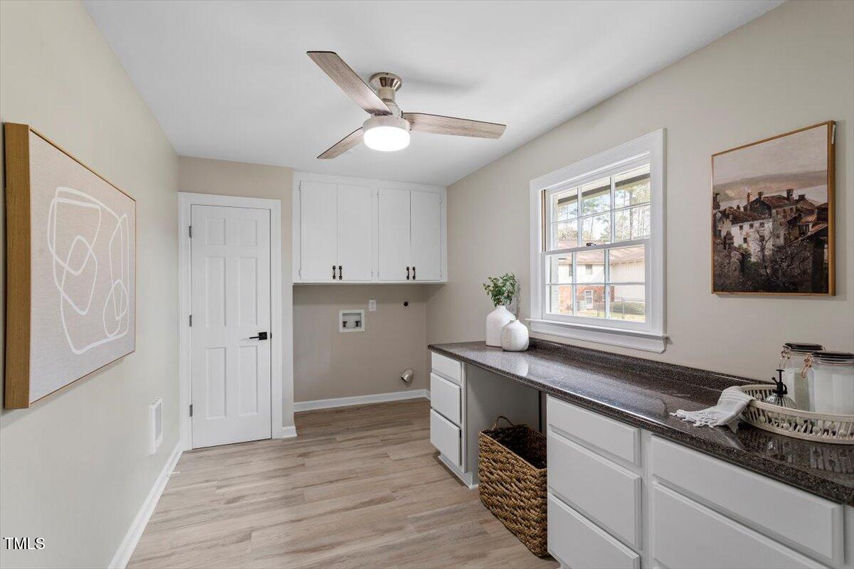 7300 Grist Mill Road Raleigh, NC 27615 - Photo 33 of 41 a kitchen with stainless steel appliances a sink stove and cabinets
