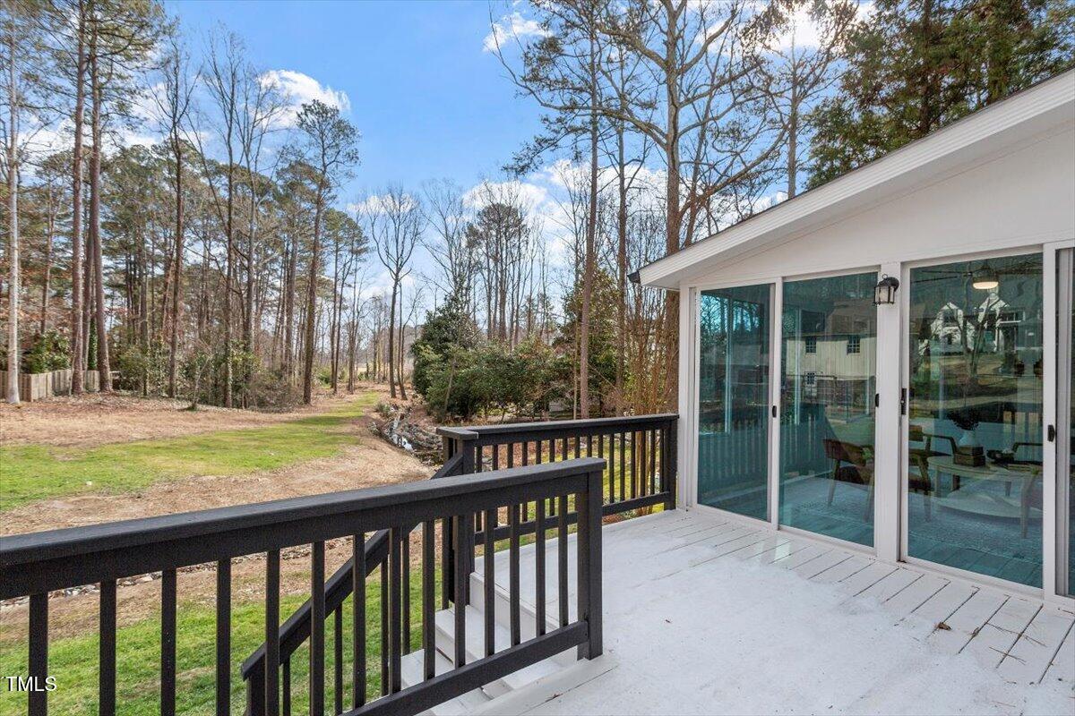 7300 Grist Mill Road Raleigh, NC 27615 - Photo 37 of 41 a view of a house with backyard and trees