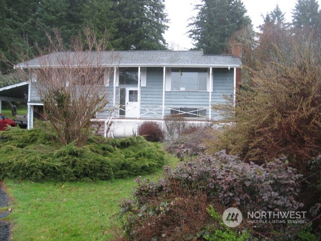 2466 North Shore Road Bellingham, WA 98226 - Photo 1 of 23 a front view of a house with garden