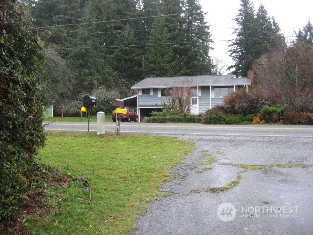 2466 North Shore Road Bellingham, WA 98226 - Photo 22 of 23 a view of a house with a yard