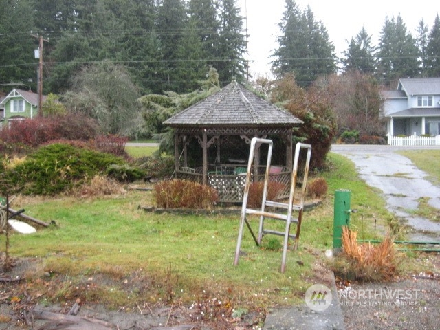 2466 North Shore Road Bellingham, WA 98226 - Photo 23 of 23 a view of a chair and table in backyard