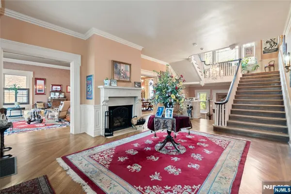 a living room with furniture a rug and a window