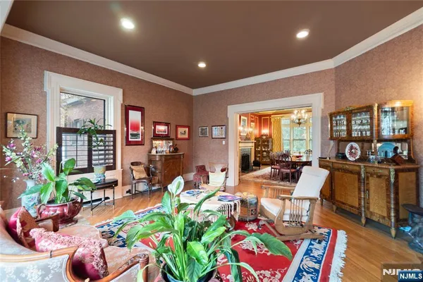 a room with lots of chairs and large windows
