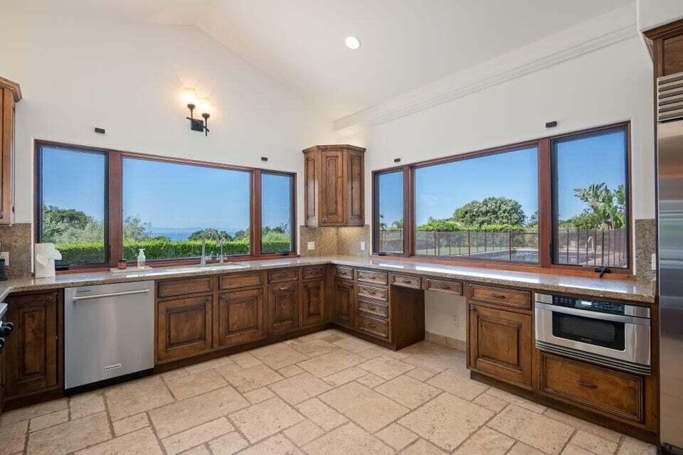 212 Alston Road Santa Barbara, CA 93108 - Photo 18 of 43 a large kitchen with stainless steel appliances granite countertop a stove a sink and a microwave