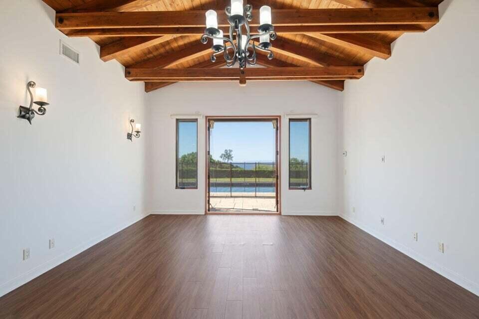 212 Alston Road Santa Barbara, CA 93108 - Photo 19 of 43 a view of an empty room with wooden floor and a window