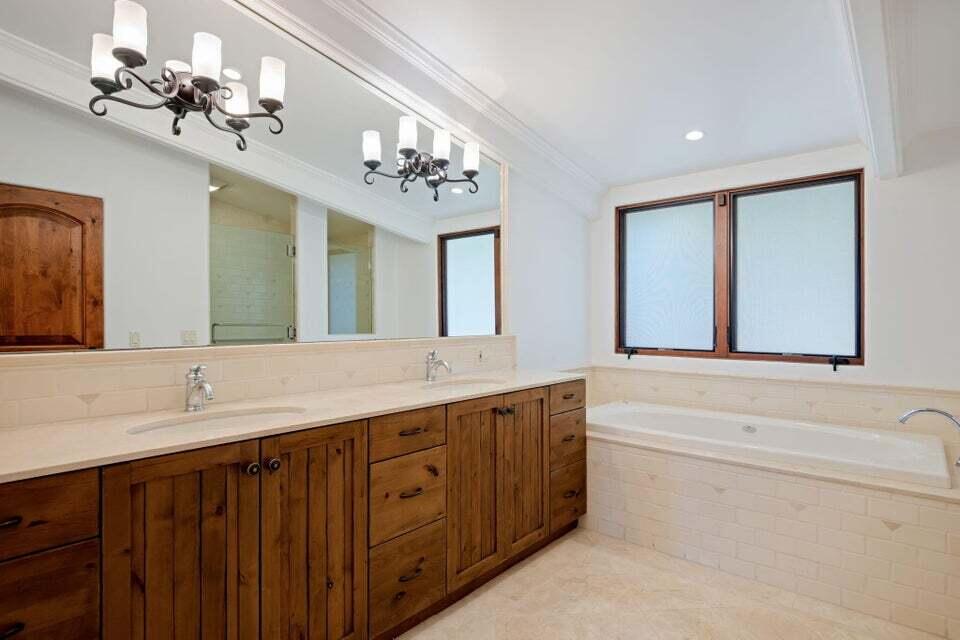 212 Alston Road Santa Barbara, CA 93108 - Photo 22 of 43 a bathroom with a double vanity sink and a bathtub