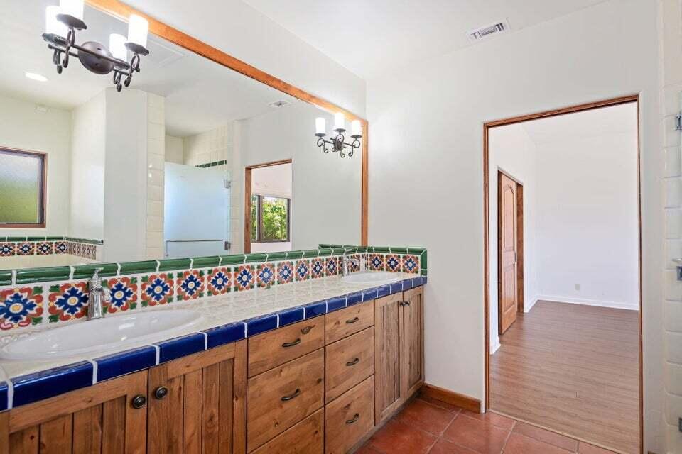 212 Alston Road Santa Barbara, CA 93108 - Photo 26 of 43 a view of a hallway with a large mirror