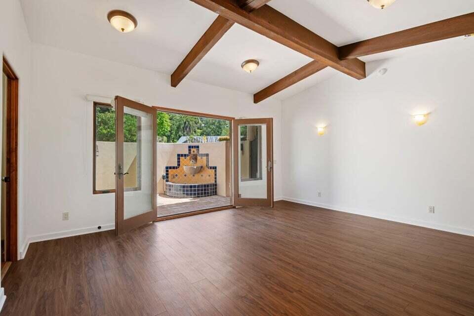 212 Alston Road Santa Barbara, CA 93108 - Photo 29 of 43 a view of a hallway with wooden floor and windows