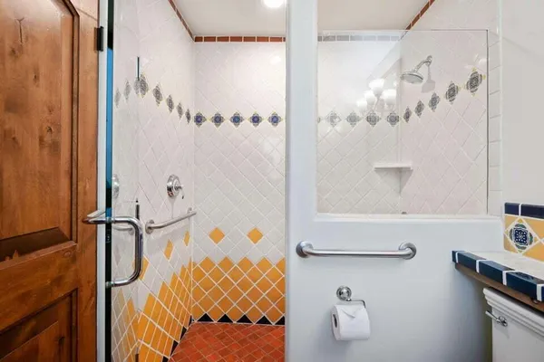 a bathroom with a tub and shower