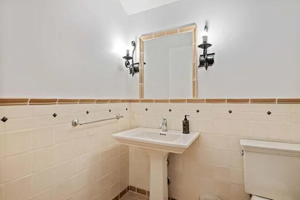 a bathroom with a sink and mirror
