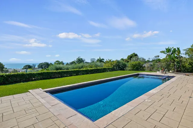 a view of swimming pool with a yard