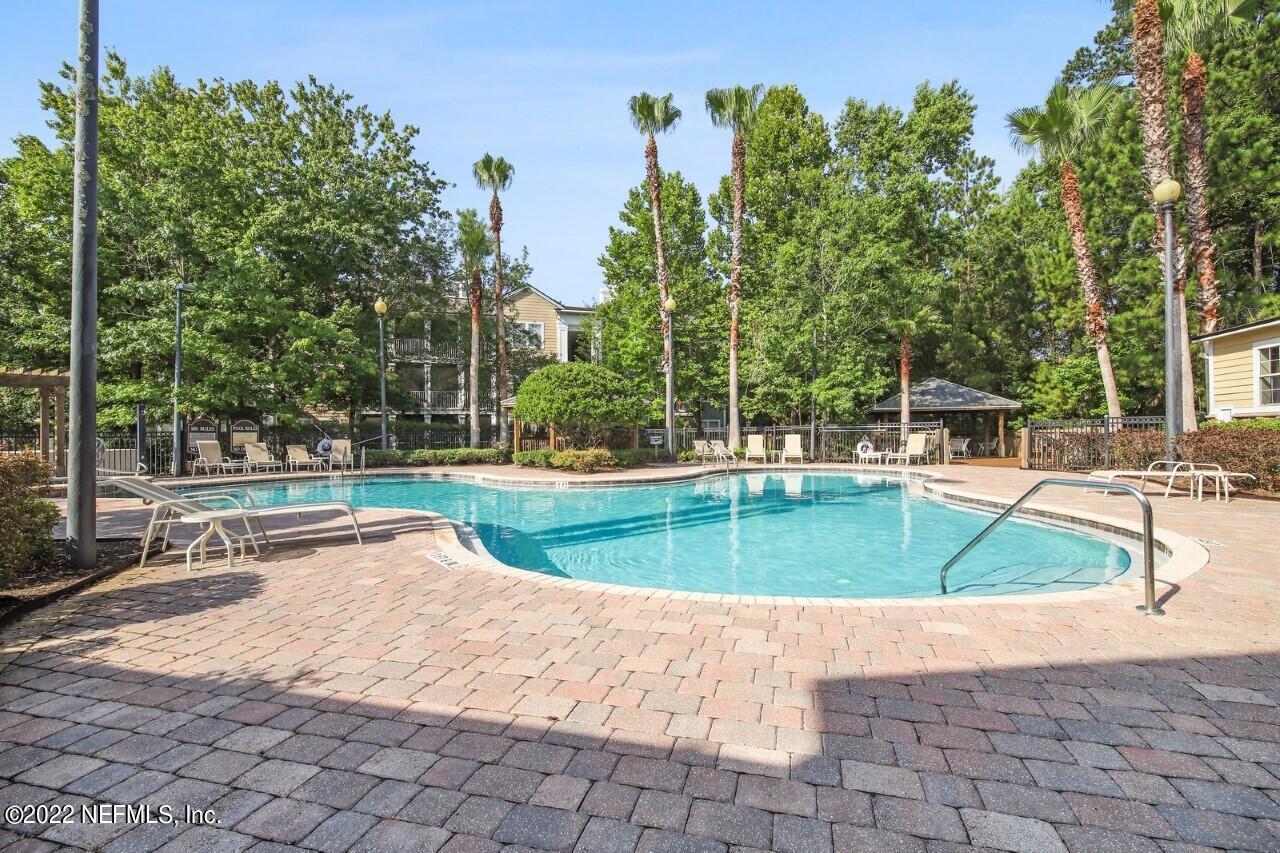 8550 Touchton Road, Unit 1328 Jacksonville, FL 32216 - Photo 28 of 32 a view of a swimming pool with a patio