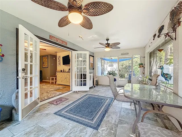 an aerial view of residential houses with outdoor space and trees