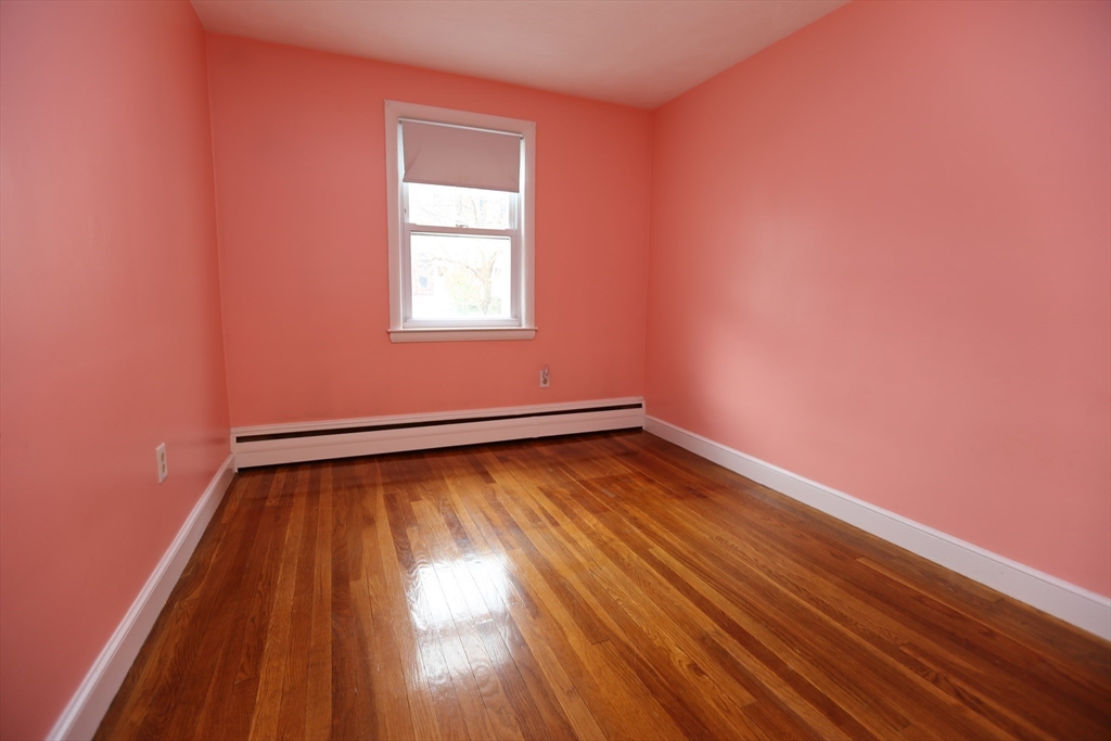 12 Lasell Street Boston, MA 02132 - Photo 11 of 22 a view of a room with wooden floor and fan