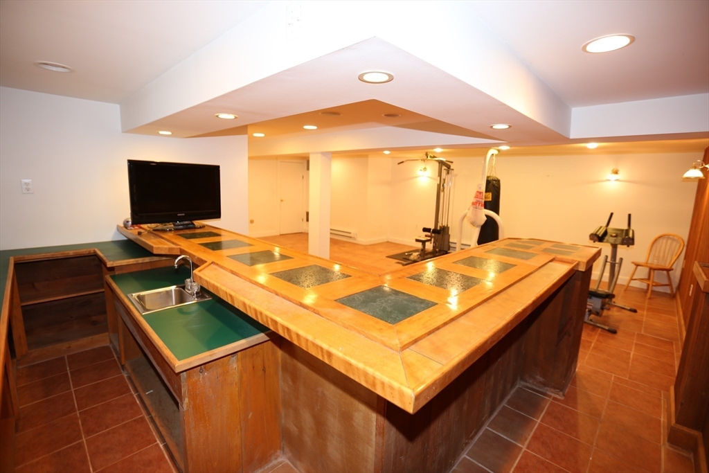 12 Lasell Street Boston, MA 02132 - Photo 18 of 22 a room with pool table and glass door