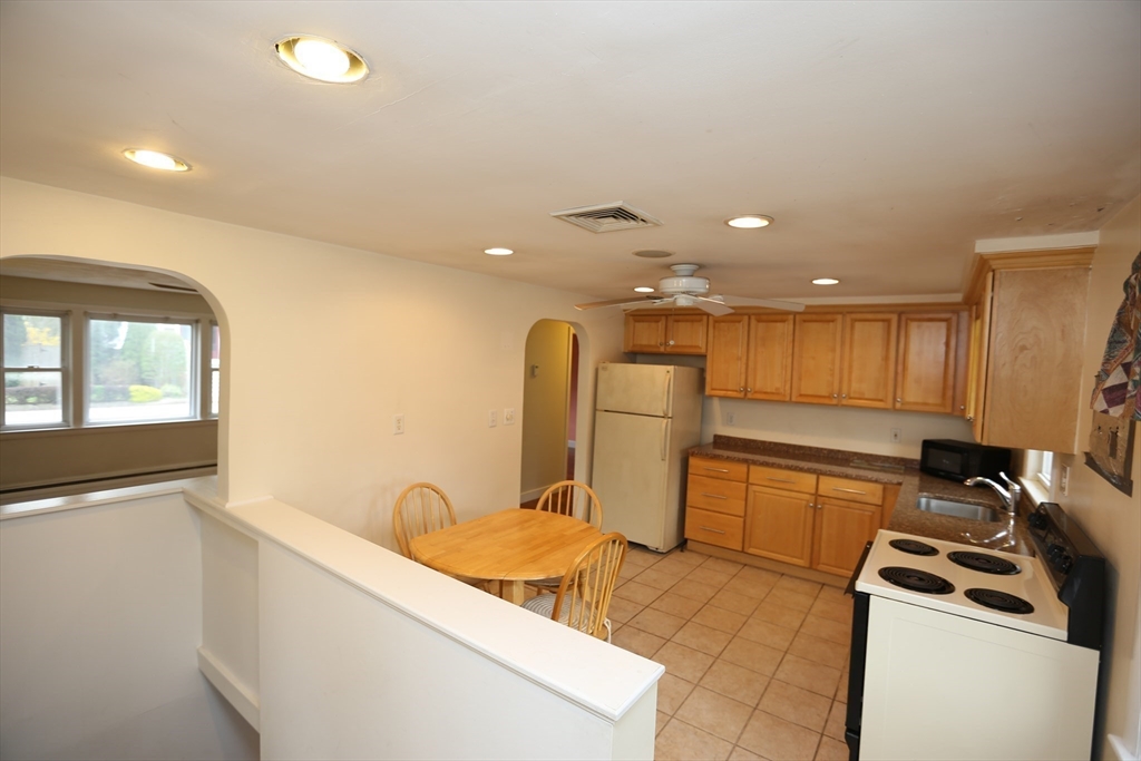 12 Lasell Street Boston, MA 02132 - Photo 6 of 22 a kitchen with a refrigerator and a sink