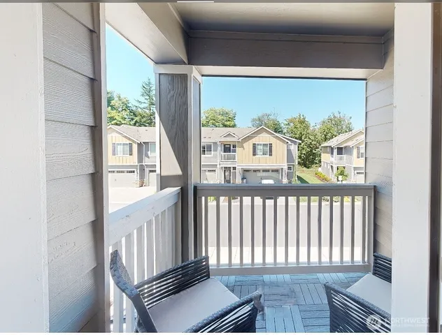 a view of a balcony with furniture
