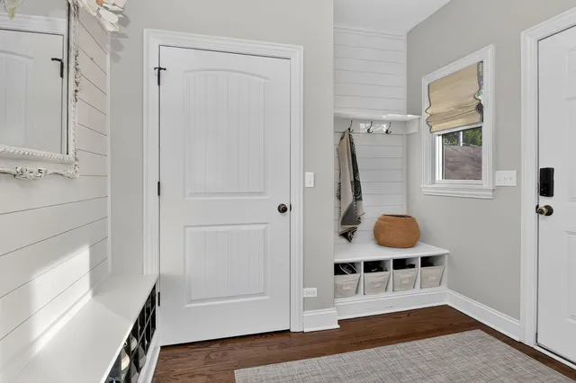 wooden floor and utility room with a window