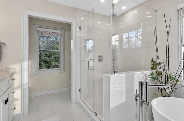 a bathroom with a shower and a sink