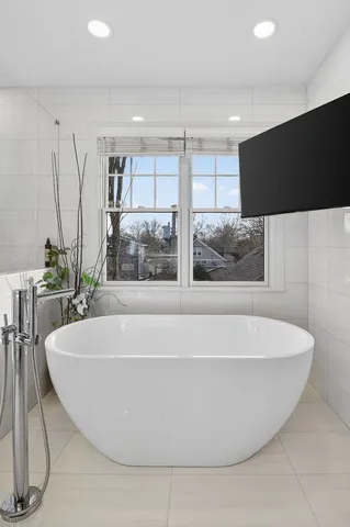 a white bath tub sitting in a room