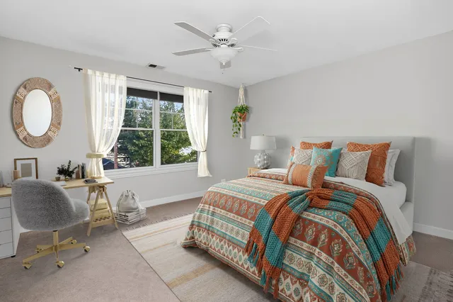 a bedroom with bed and window