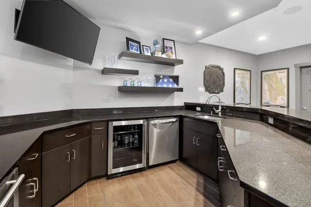 a kitchen with stainless steel appliances a sink stove and cabinets