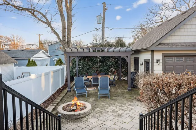 a view of a patio with table and chairs and potted plants