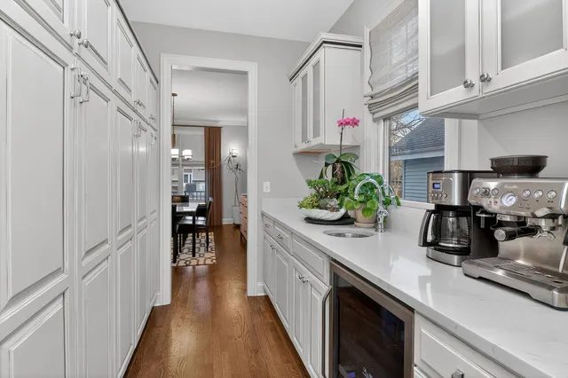 a kitchen with counter top space cabinets and wooden floor