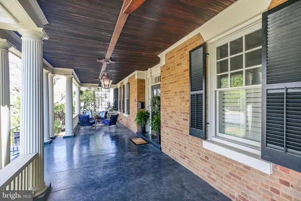 a bathroom with a sink toilet and a mirror