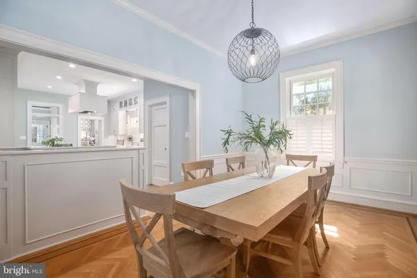 a living room with furniture large window and a fireplace