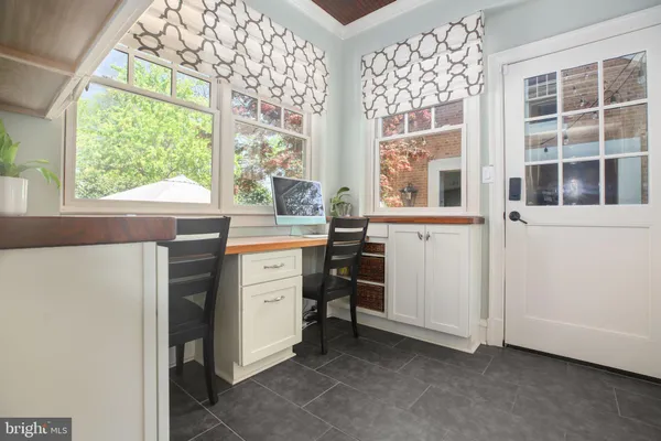 a view of staircase with wooden floor and a window