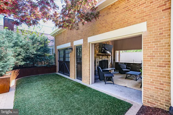 a kitchen that has a lot of cabinets in it and wooden floors