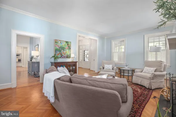 a view of a kitchen with white cabinets and a stove