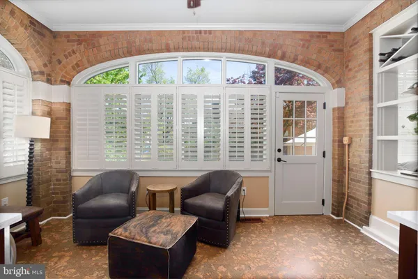 a spacious bedroom with a bed and a window