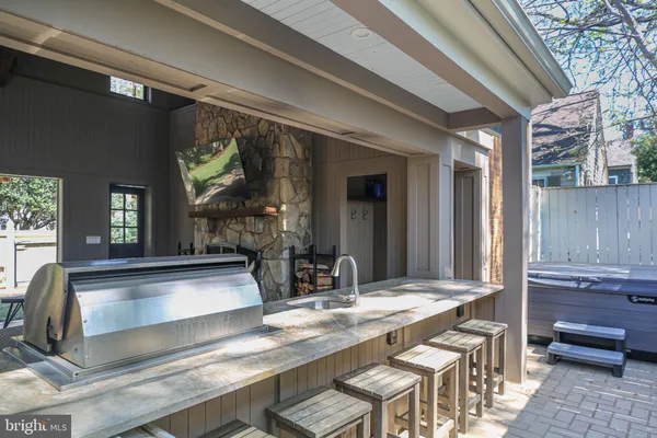 a kitchen with a table chairs sink and cabinets