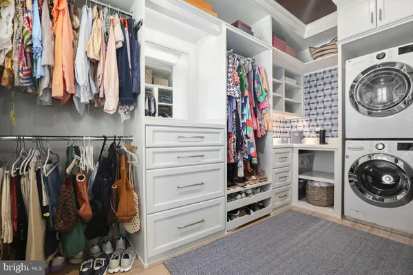 a bathroom with a toilet sink and a mirror