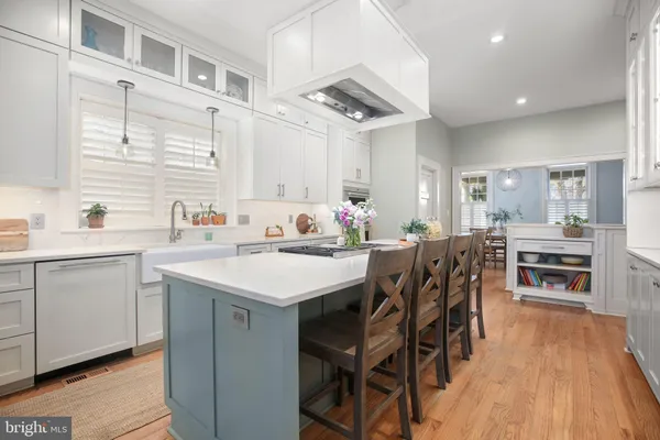 a bathroom with a double vanity sink a mirror and shower