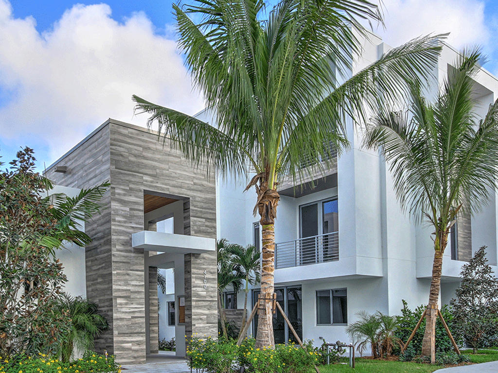 a front view of house with small garden