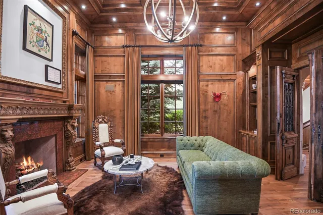 a living room with furniture a window and a fireplace