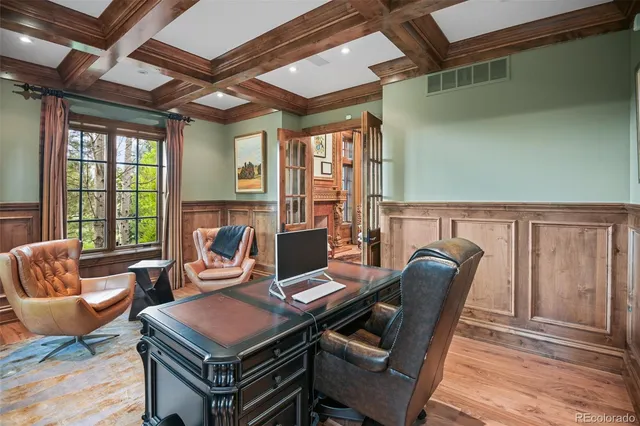 a living room with furniture a ceiling fan and a window