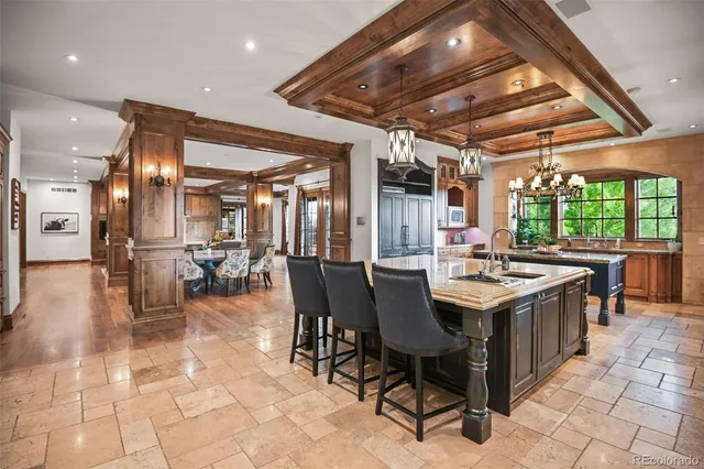 a kitchen with a table and chairs