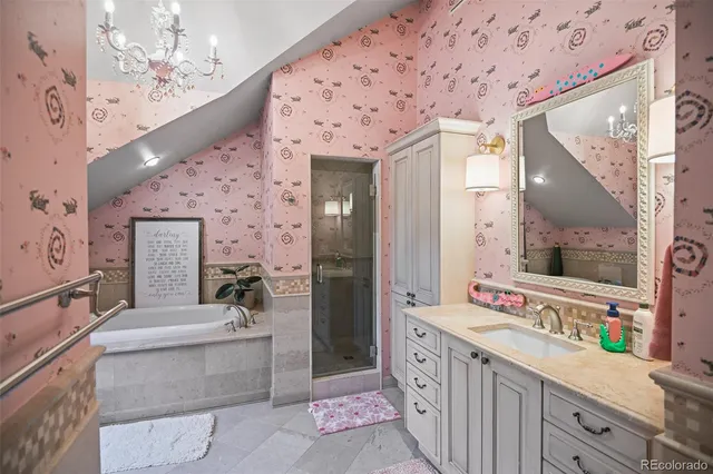 a spacious bathroom with a double vanity sink mirror and bathtub