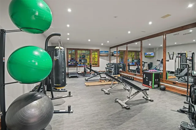 a room with gym equipment and a mirror